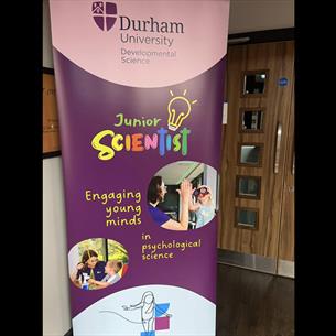 Junior Scientist banner at Durham University showing photos of children and adults high-fiving each other and doing activities together. 