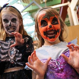 Two children in Halloween costumes, with painted faces at Hopetown Darlington. 