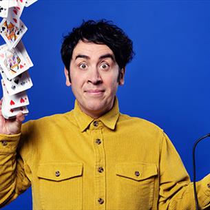 Pete Firman throwing a pack of cards ito the air