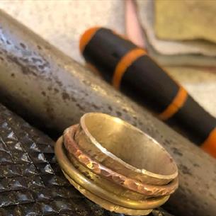 Silver spinner ring and tools.