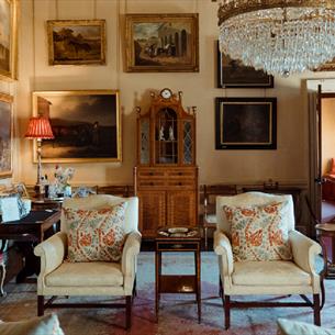 Opulent room at Raby Castle with a chandelier and paintings
