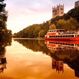 Prince Bishop River Cruiser on the River Wear with Durham Cathedral in the background.