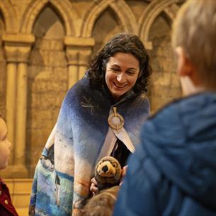 Elizabeth Baker, local storyteller and writer, entertaining children at Durham Cathedral with thought-provoking tales. 