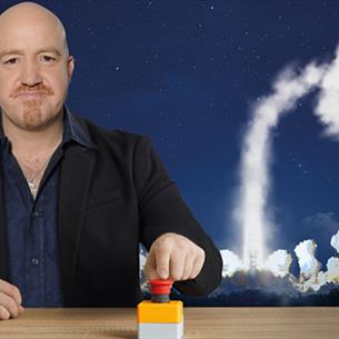 Any Parsons pressing a button with an image of a rocket launching into space behind him