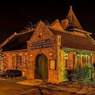 A historic parish hall lit by low lighting in the dark