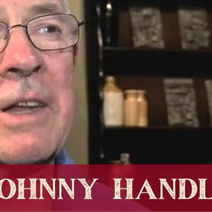 A close up of a person wearing glasses, Johnny Handle.
