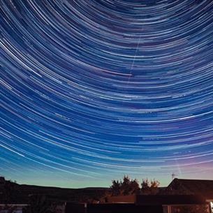 Star trails in a dark sky above the Grassholme Observatory.