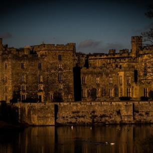 Haunted Raby: Ghost Walk Tour - Darkened picture of the castle exterior across the lake. 