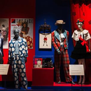 Vivienne Westwood displays at the Bowes museum, tartan suits and polkadot clothing. Red and Blue theme.