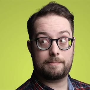 Person wearing glasses, shoulders up, looking off to the side against a lime green background.