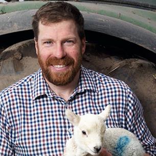 Jim Smith holding a lamb
