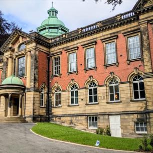A view of the exterior of Redhills Durham Miners Hall on a sunny day.
