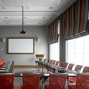 Meeting room with chairs, large table and screen
