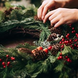 Someone making a Christmas Wreath