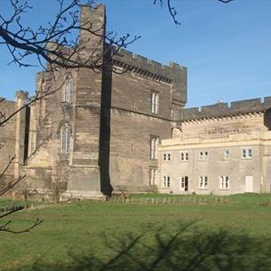 Exterior view of the walls and towers of Brancepeth castle