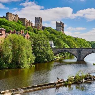 The River Wear in Durham City, Framwellgate Bridge and Durham Castle and Cathedral in the distance.