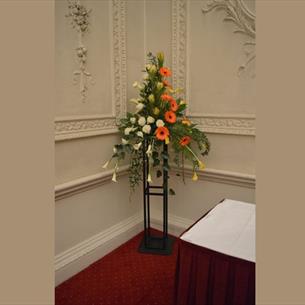 Flower arrangement with white and orange flowers