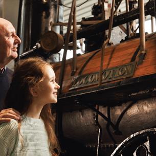 Grandad and Granddaughter looking at Locomotion