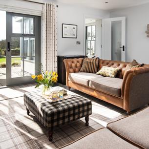 Light and airy lounge with French windows opening onto the garden.