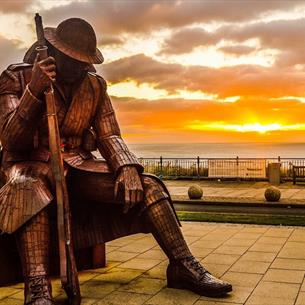Tommy statue at sunset