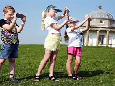 Three children at Hardwick Park using App