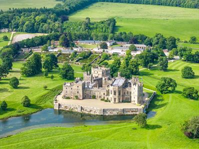 An overhead drone shot of the castle and grounds
