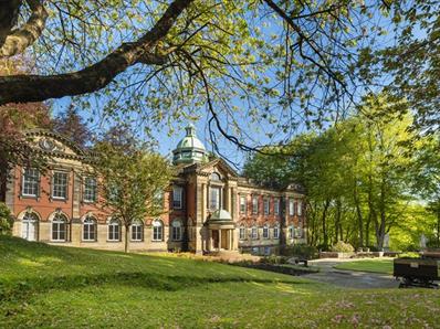 A view of the exterior of Redhills Durham Miners Hall on a sunny day.