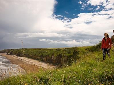 couple walking on the Durham Heritage Coast