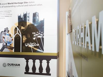 Image of an information board showing Durham Cathedral and text describing the World Heritage Site at Palace Green Library.