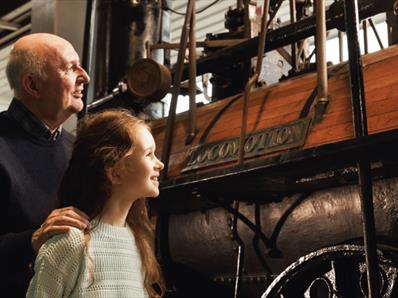 Grandad and Granddaughter looking at Locomotion