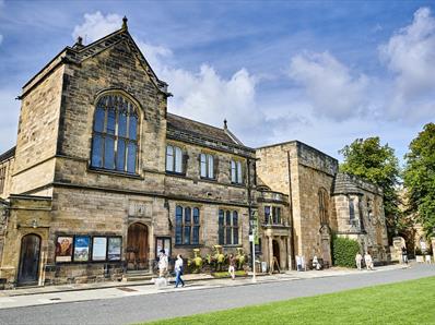 Image of Palace Green Library's exterior on a sunny day.