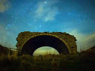An arch at night