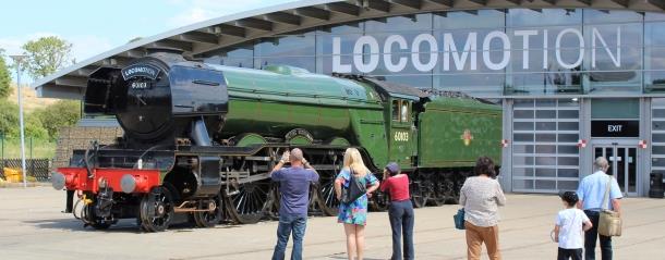 People outside of the Locomotion attraction