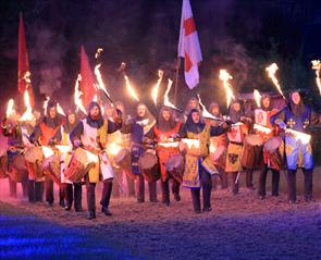 A group of actors from Kynren with drums