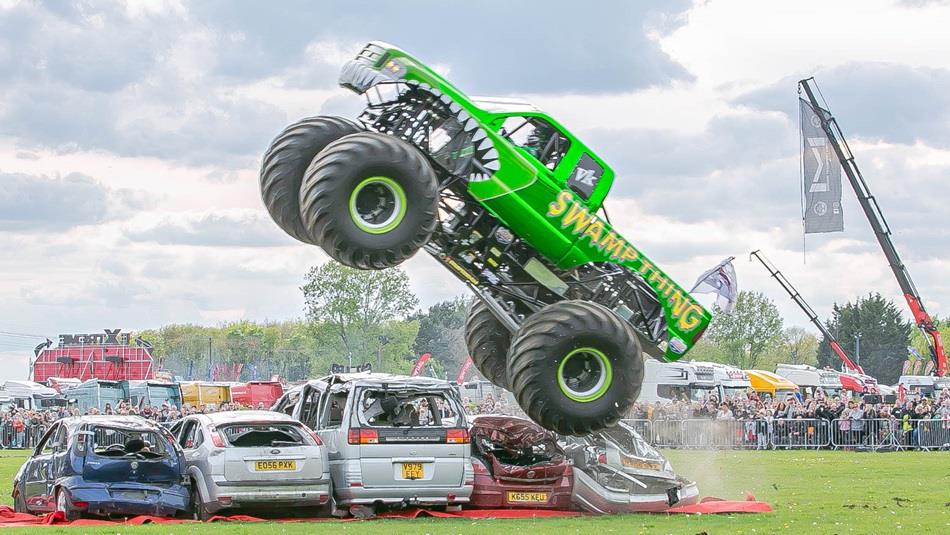 Green truck with the name Swamp Thing painted on the side