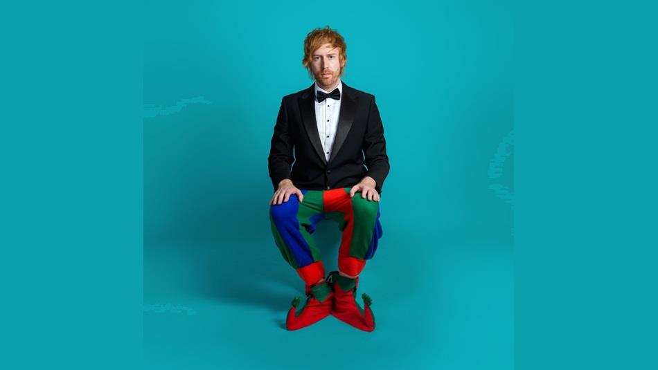 Mark Simmons dressed in a dinner jacket with Jester's trousers and shoes