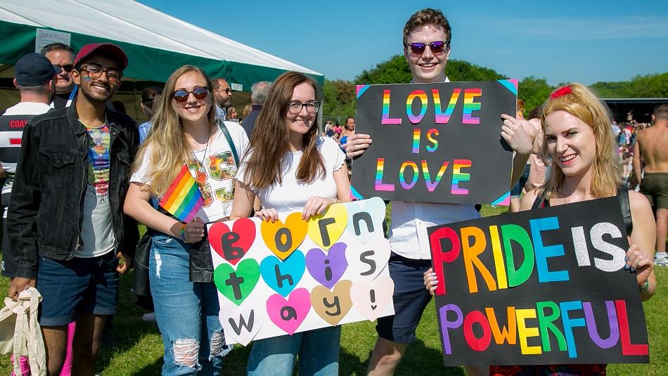 Crowds gather in rainbow colours to celebrate Durham Pride.
