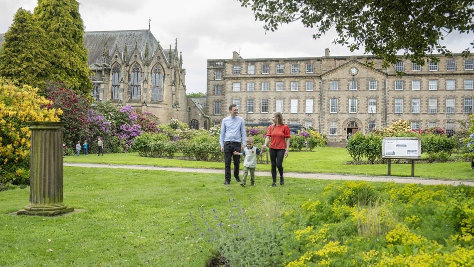 A family walking in the grounds of Ushaw
