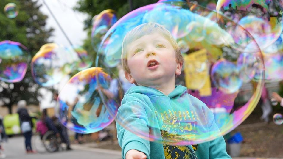 A child playing with bubbles at Hopetown Darlington.