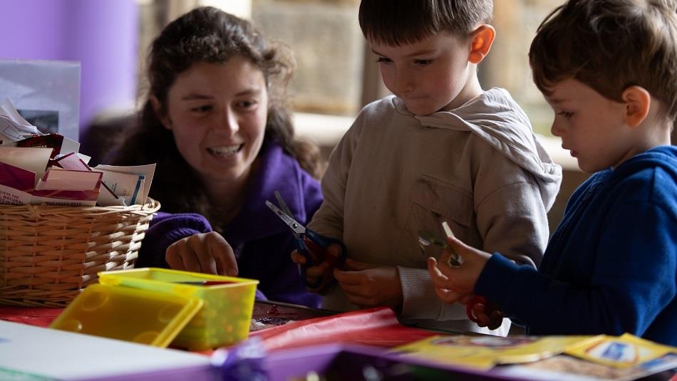 3 children enjoying craft activities
