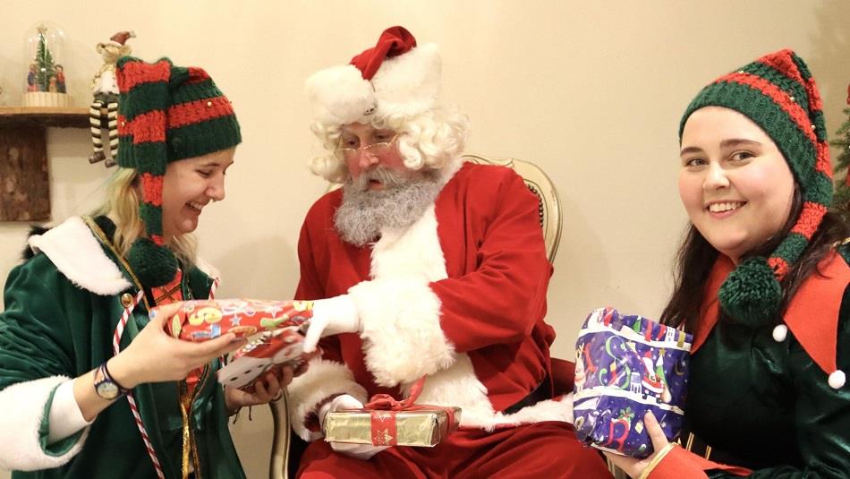 Santa and his elves exchanging gifts at Prince Bishops Place, Durham 
