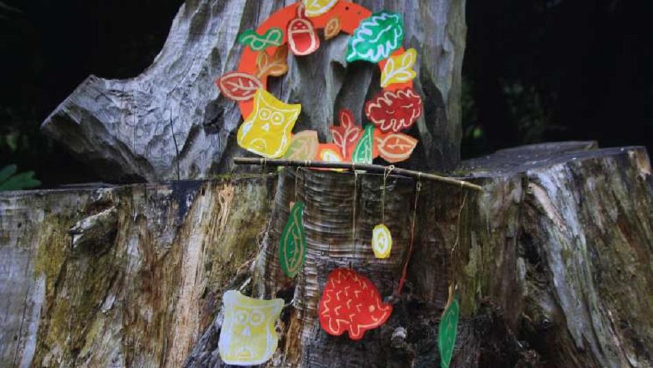 Colourful Autumn prints of hedgehogs, owls, and leaves on a tree at Ushaw