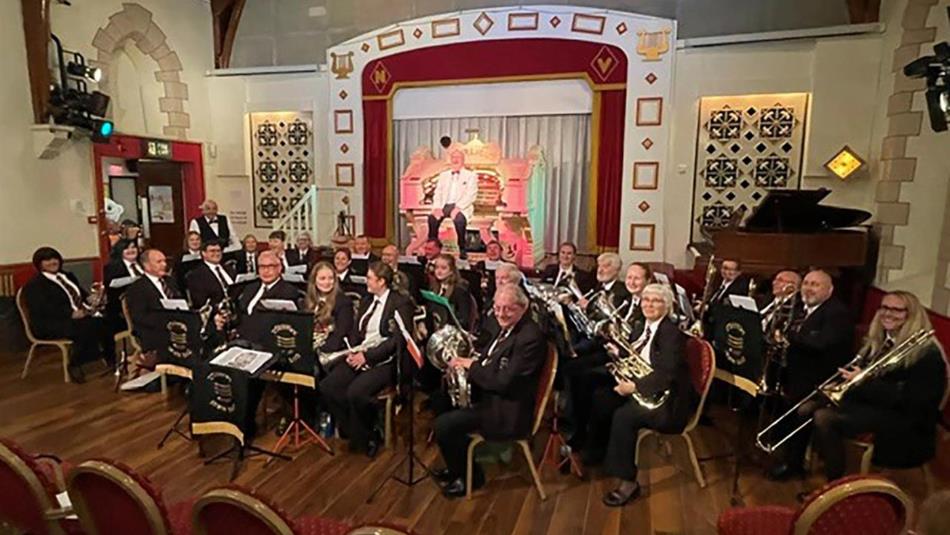 Brass band playing to an audience at the New Victoria Centre.