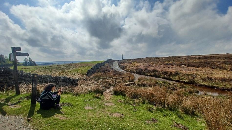 Countryside around Blanchland with women using App.