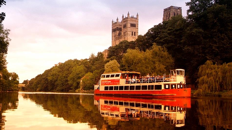 The Prince Bishop River Cruiser sailing on the River Wear in Durham City with the Cathedral in the background