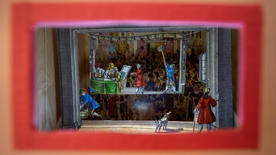 A painting of a historical stage production.