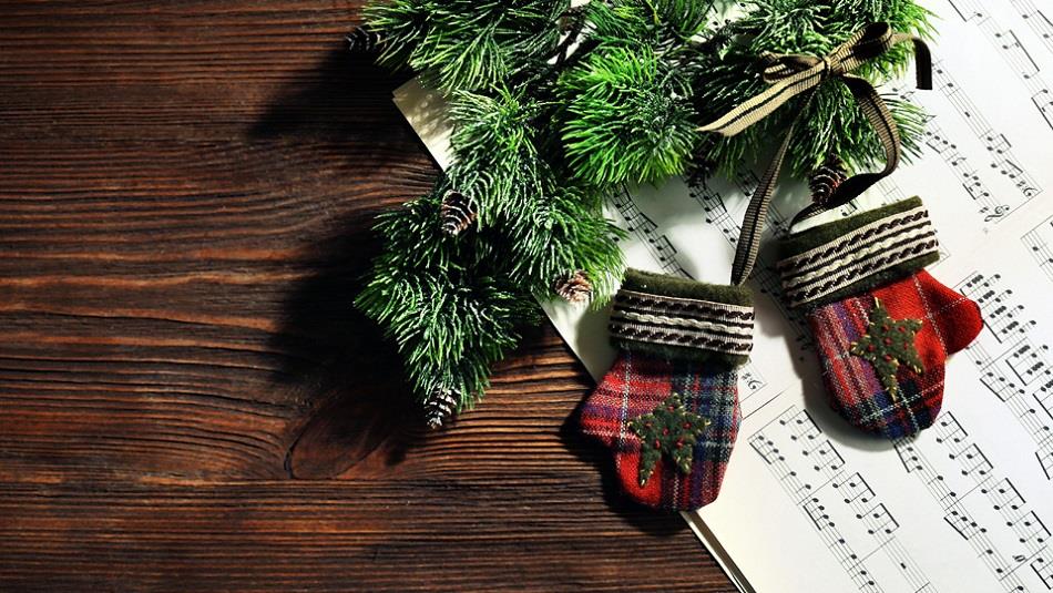 Image of festive decorations resting on festive sheet music