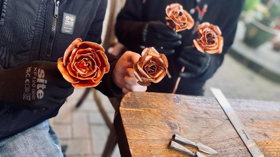 Copper Rose Workshops - people holding copper roses at South Causey Inn.