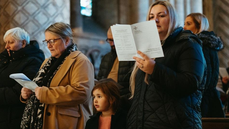 Congregation taking part in the Carols for All service