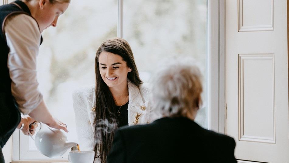 Two people having afternoon tea at High Force Hotel.